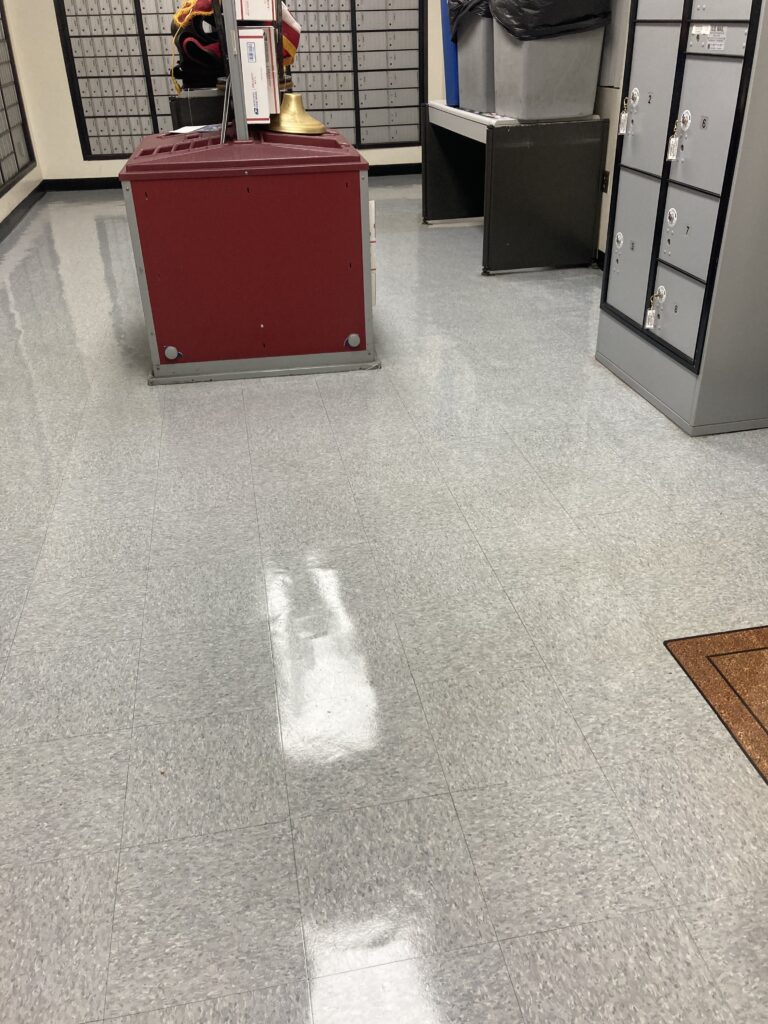 Freshly waxed commercial floor with a high-gloss finish